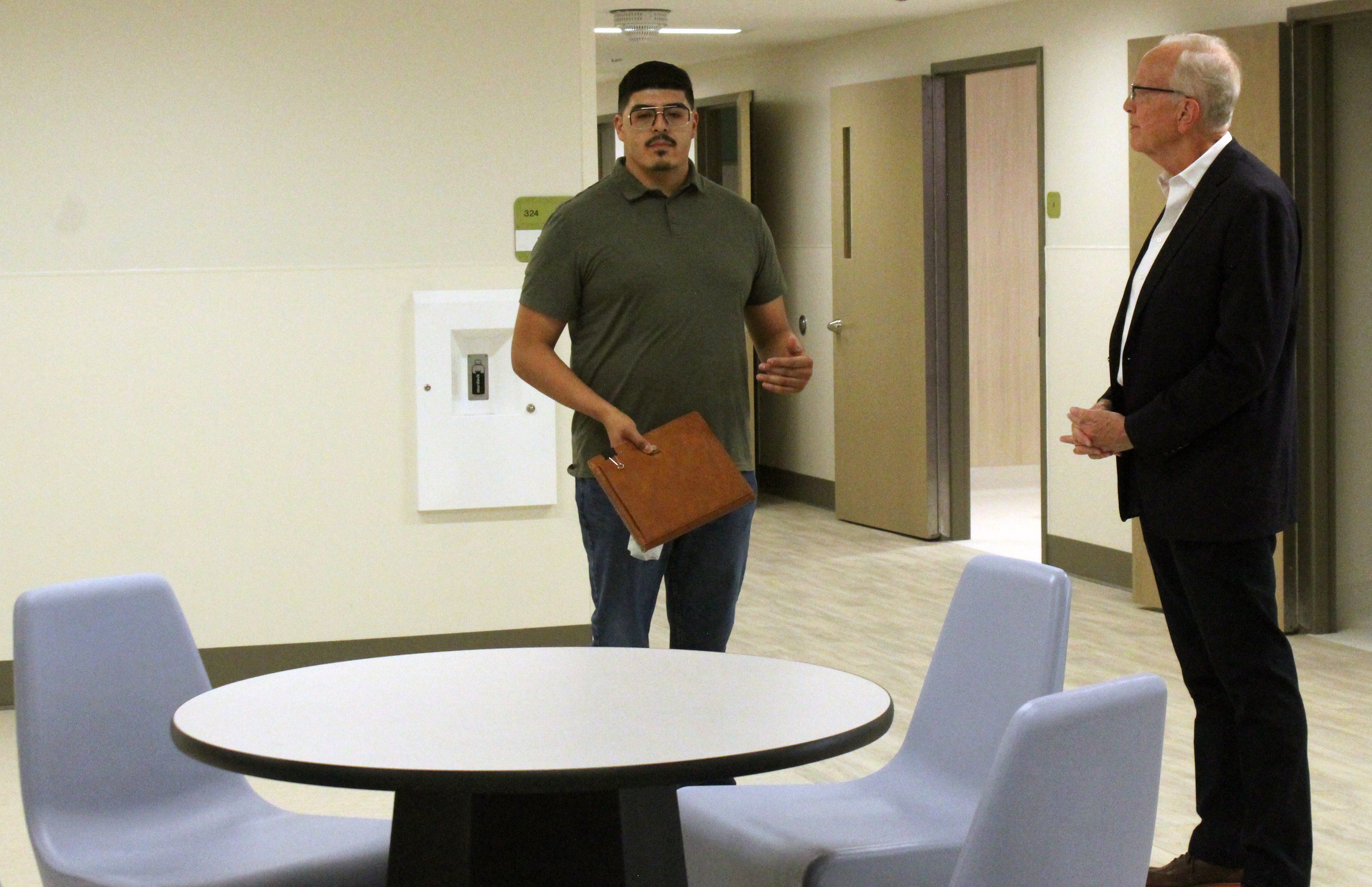 Benito Rivera-Madrid, Crisis Intervention Center operations manager, discusses the center during a tour on Thursday. The center will be able to accommodate 16 patients. Photo by Cristina Janney/ Hays Post<br>