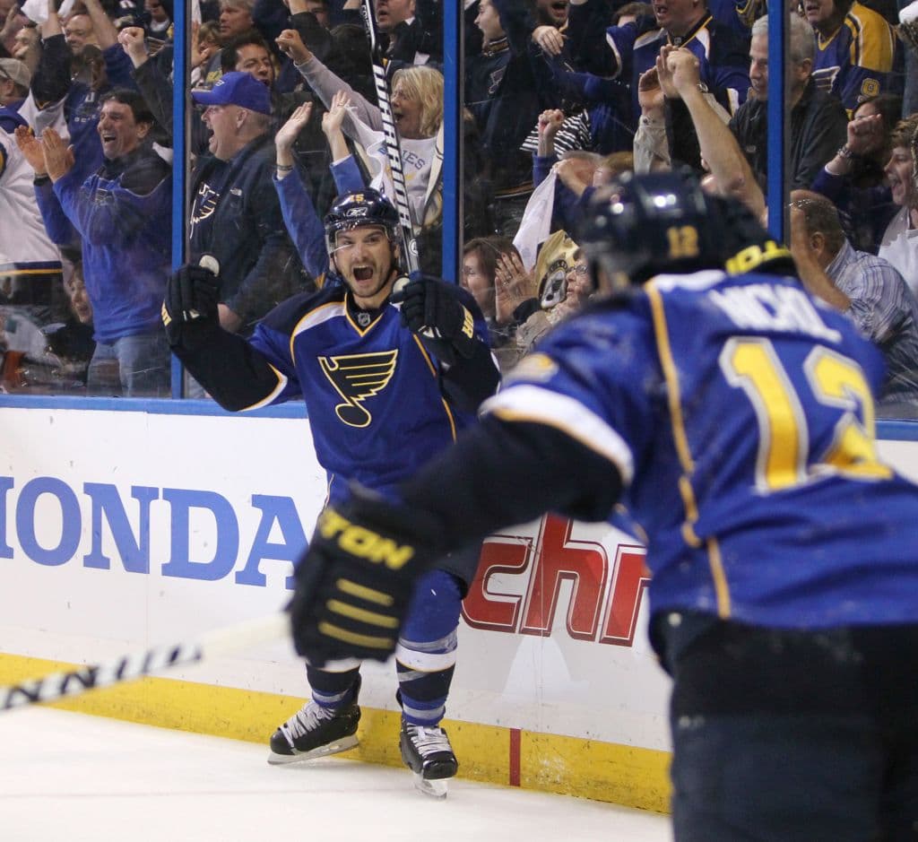 St. Louis Blues right wing Jamie Langenbrunner celebrates after scoring the tying goal against the San Jose Sharks, on an assist from teammate Scott Nichol (foreground), in the third period of Game 5 of the NHL Western Conference Quarterfinals at the Scottrade Center in St. Louis, Missouri, Saturday, April 21, 2012. The Blues beat the Sharks, 3-1, and closed out the series, four games to one game.