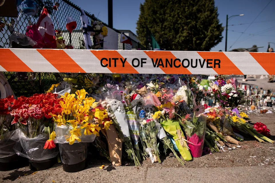 People are pictured at one of the many memorials to the victims of the Lapu-Lapu mass murders in Vancouver, B.C., on Thursday, May 1, 2025.