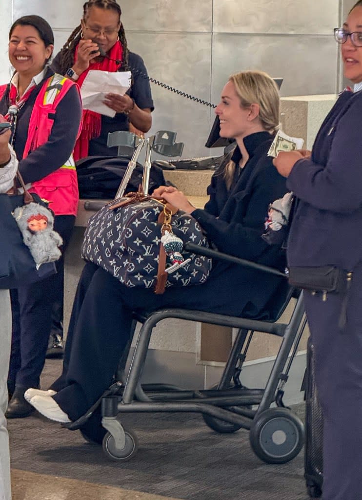 Lindsey Vonn was spotted being assisted through the airport in a wheelchair with crutches in hand, after suffering an injury following her heroic Olympic efforts. KONY / BACKGRID