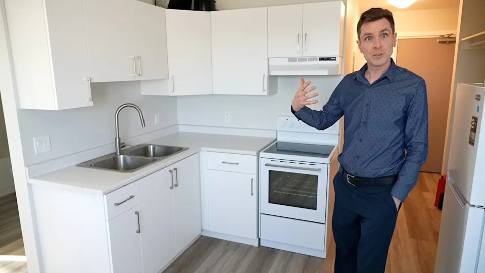 Eden Health Care Services housing and supports director Leighton Knapp in an apartment at Winkler's Central Commons.