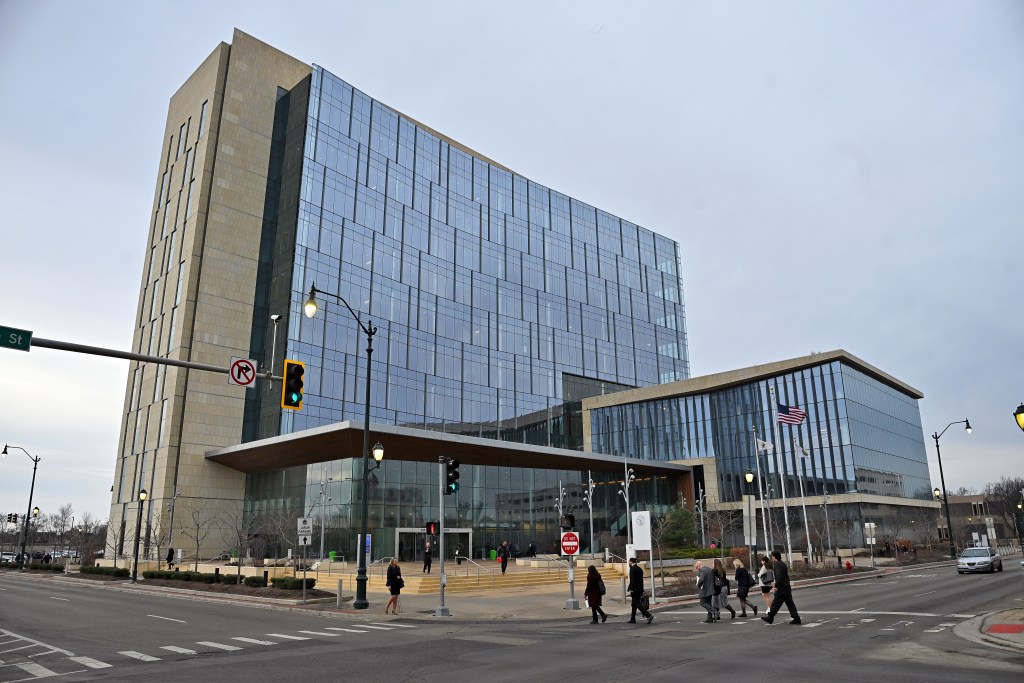 Pedestrians cross the intersection near the Will County Courthouse on Thursday, Jan. 8, 2026, in Joliet, Illinois.
