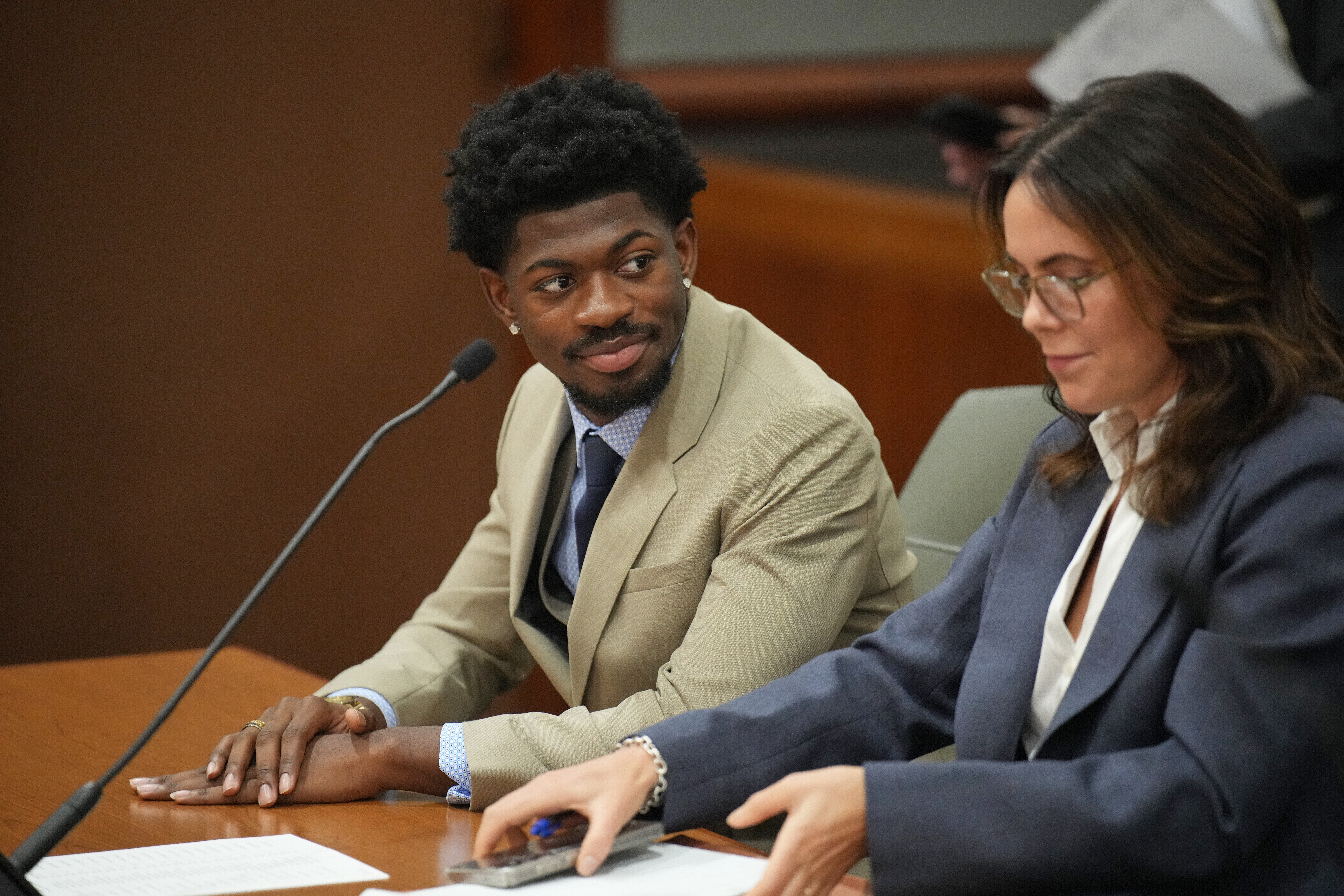 Lil Nas X, whose legal name is Montero Lamar Hill, appears in court charged with four felony counts, including three counts of battery with injury on a police officer in Los Angeles on March 12, 2026