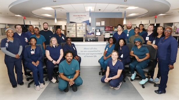 Retreat Doctors' Hospital Progressive Care EMU colleagues smiling for picture in the hospital 