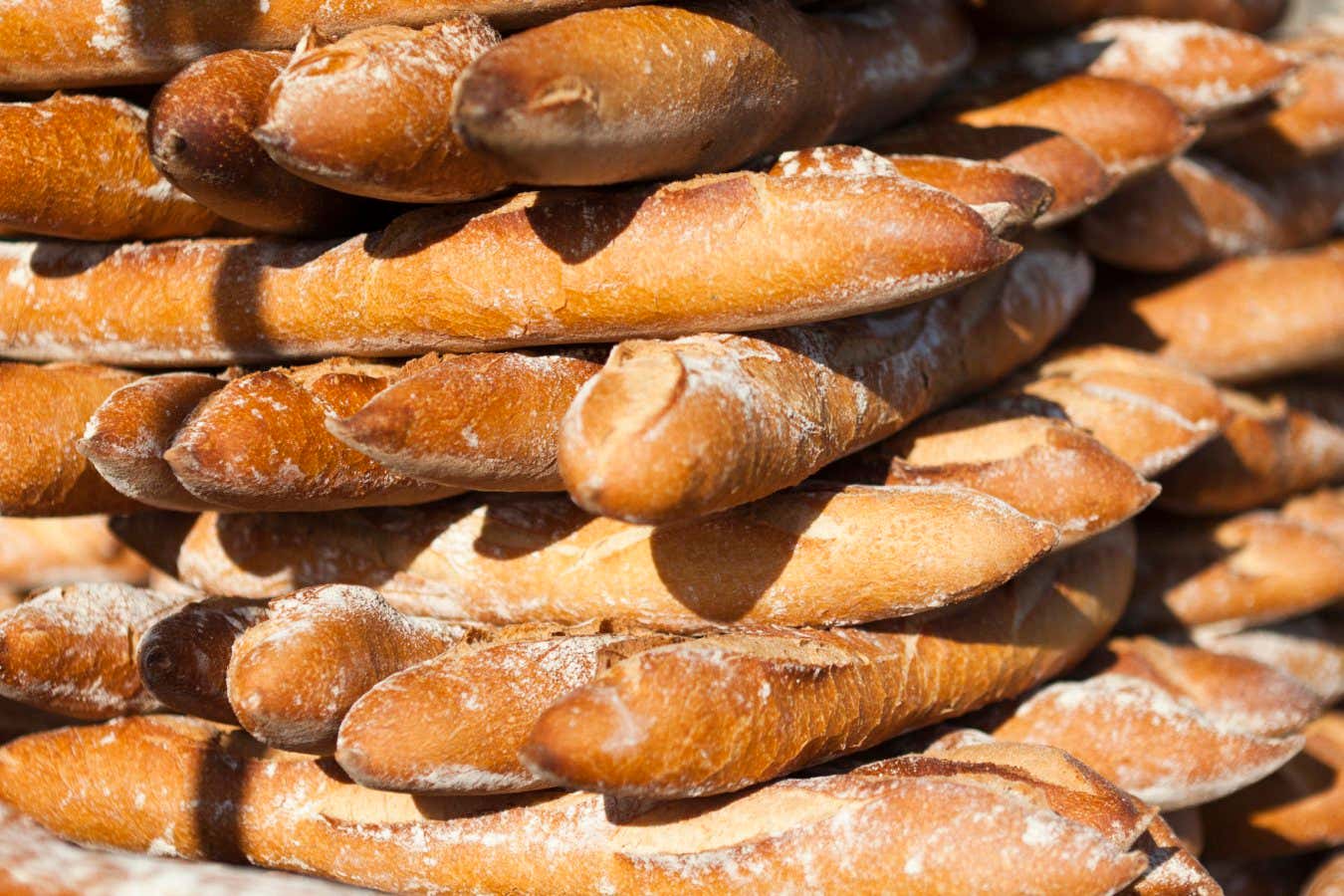 Baguettes stacked at a bakery
