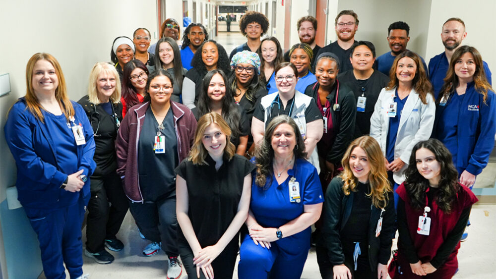 TriStar Centennial Medical Center 6 Tower colleagues smiling for a picture in the hospital's hallway