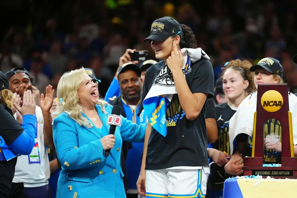 ESPN reporter Holly Rowe speaks to UCLA Bruins center Lauren Betts (51) on the podium after the win against the South Carolina Gamecocks in the National Championship game of the women's 2026 NCAA Tournament at Mortgage Matchup Center.