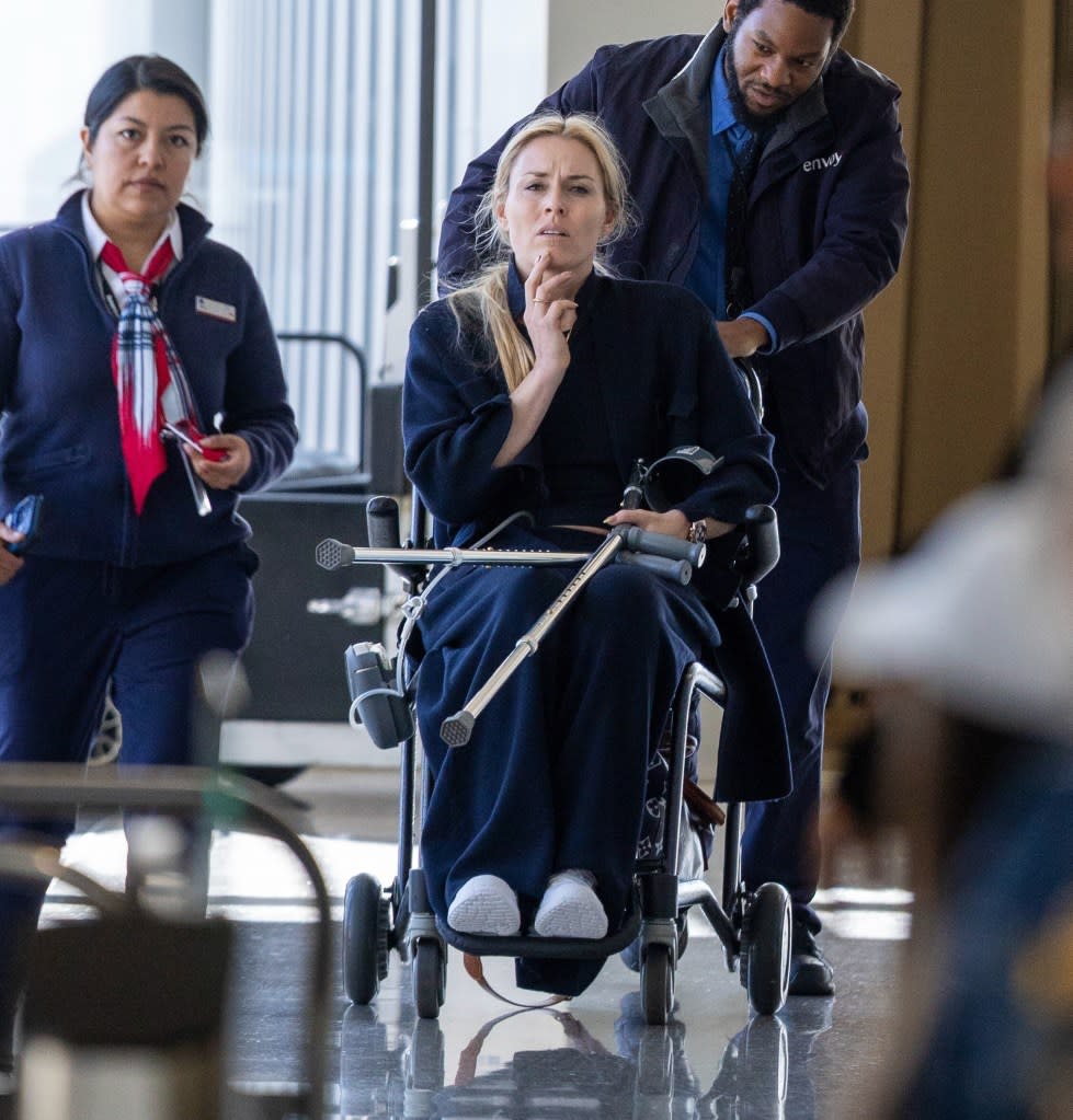 Lindsey Vonn was spotted being assisted through the airport in a wheelchair, with crutches in hand, after suffering an injury following her heroic Olympic efforts. KONY / BACKGRID