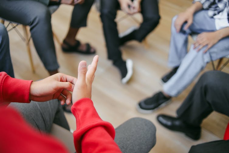 Close up of people in a group therapy session.