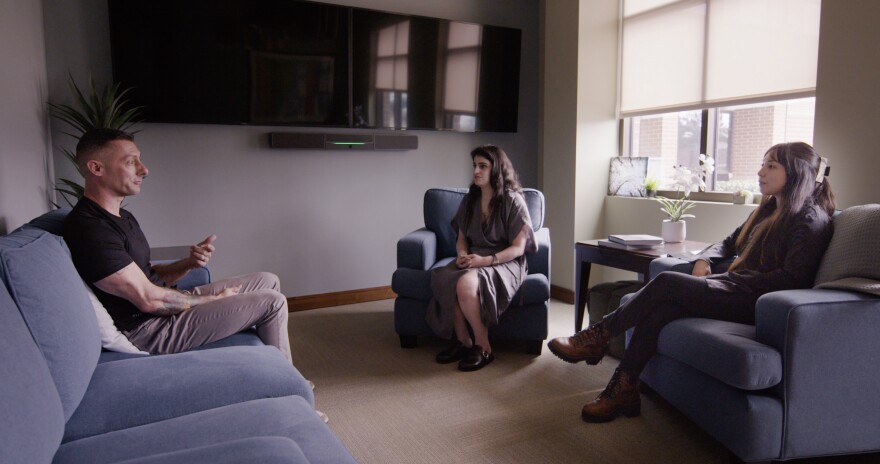 Marine Corps combat veteran Ryan Roberts participated in a mock therapy session in 2025 for Texas Public Radio’s Petrie Dish podcast series, Psychedelics and the Texas Trip. Roberts is in a psilocybin dosing room with assistant professor Amanda Tamman (center) and research coordinator Mia Del Motte (at right) who supported Baylor College of Medicine’s psilocybin study for veterans with PTSD at the Menninger Clinic in Houston