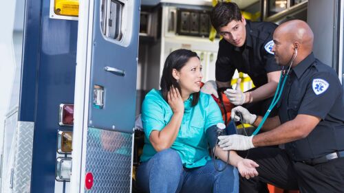 Paramedics talking to mental behavioral health patient EMS.jpg