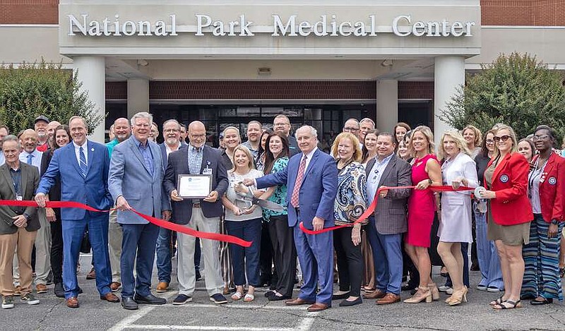 National Park Medical Center staff, dignitaries and others joined the Greater Hot Springs Chamber of Commerce Ambassadors, known as the Red Coats, for a ribbon cutting for the new adult behavioral health unit at the hospital. (The Sentinel-Record/Thomas Buckman)