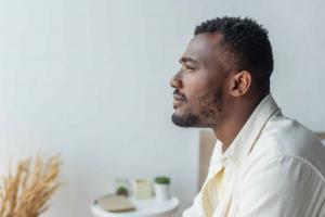 side-view-of-pensive-young-african-american-man-lo-2026-01-06-00-03-49-utc-scaled