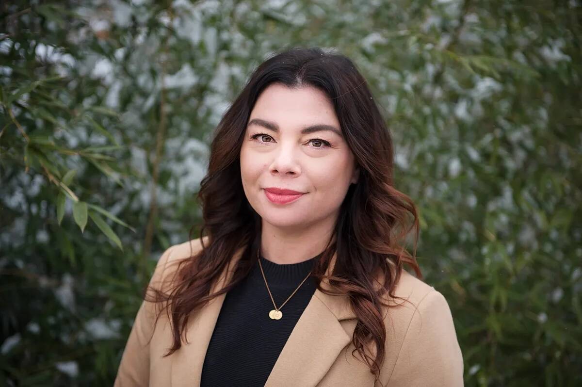 Head-and-shoulders photo of Dr. Briana Hagen, a person in front of a wall of greenery. Pic: ccaw.ca