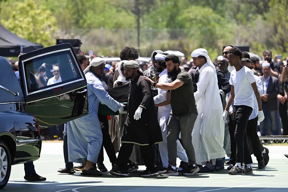 Family members carrying the casket of one of the shooting victims at the service. Denis Poroy for CA Post