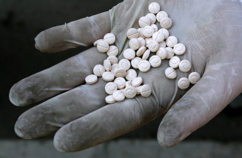 (Illustrative) A customs officer displays Captagon pills. Sofia, 12, 2007.