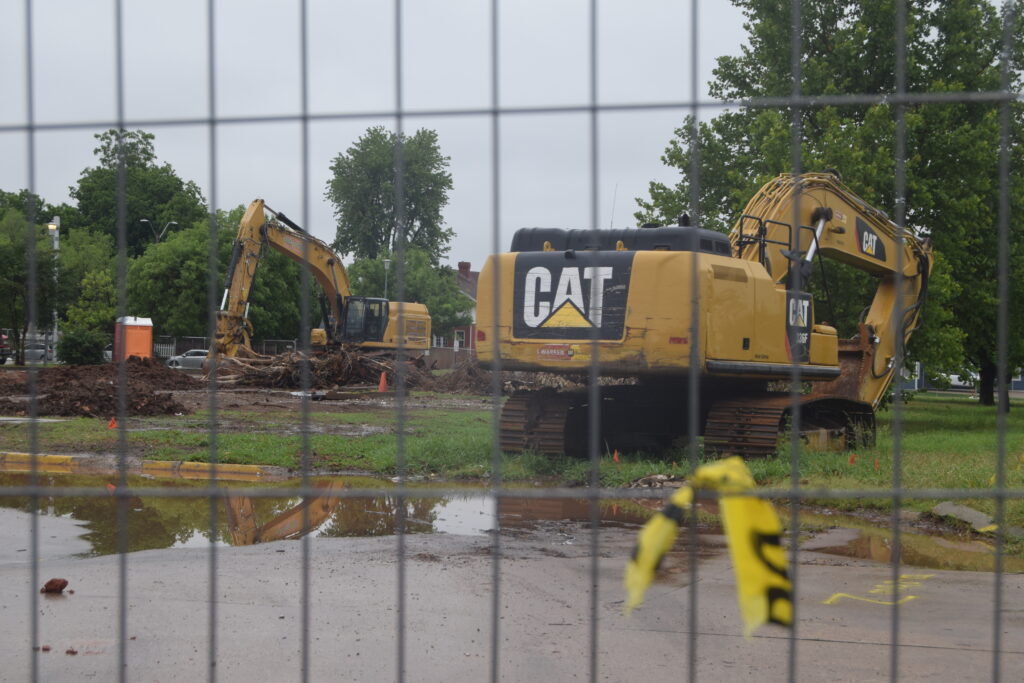CAT bulldozers and heavy equipment rest in the bulldozed lot that formerly held the Lottie House, a temporary shelter, and will soon hold a mental health crisis center. (Photo/Sam Royka, The Journal Record)