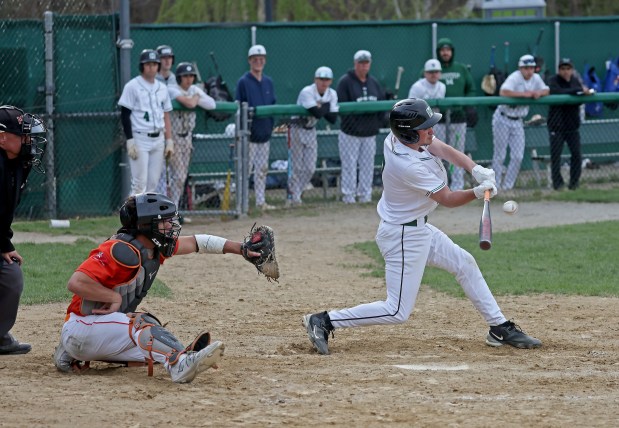 Mansfield's Jacob Bianchi strokes his single in the seventh inning as Mansfield take on Taunton in baseball. (staff photo by Stuart Cahill/Boston Herald)