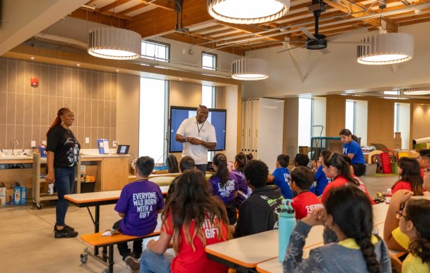 Angela Brantley, executive director of the IAMGIFTED Foundation, and Ray Phillips, program director for the foundation's Youth Empowerment Saturday program, speak to students at a Saturday, Sept. 13, 2025, organization event. (Courtesy of IAMGIFTED Foundation)