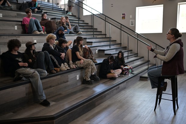 Peer recovery coach Brittany Kitchens, right, speaks during a group therapy-style discussion called B.O.A.T., which stands for "Being Open and Authentic Together" with the students at 5280 High School in Denver on Wednesday, May 21, 2025. (Photo by Hyoung Chang/The Denver Post)