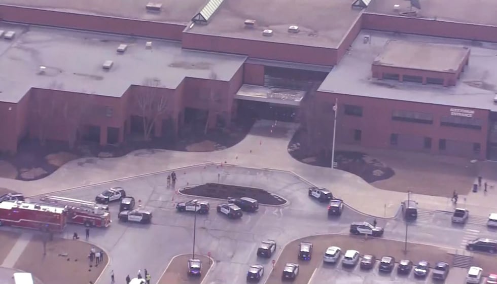 Police said a suspect was shot and taken into custody after shooting an administrator and a...