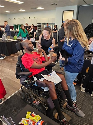 Army Veterans Lyndsey Hawk-Nelson and Dustin Hawk greet a puppy during an open-house at Wounded Warrior Project's San Antonio office. Lyndsey serves as her husband's caregiver after he survived a stroke. Army Veterans Lyndsey Hawk-Nelson and Dustin Hawk greet a puppy during an open-house at Wounded Warrior Project's San Antonio office. Lyndsey serves as her husband's caregiver after he survived a stroke.