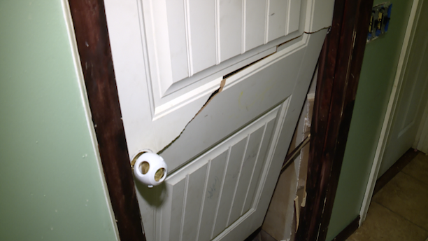 broken basement door.png
