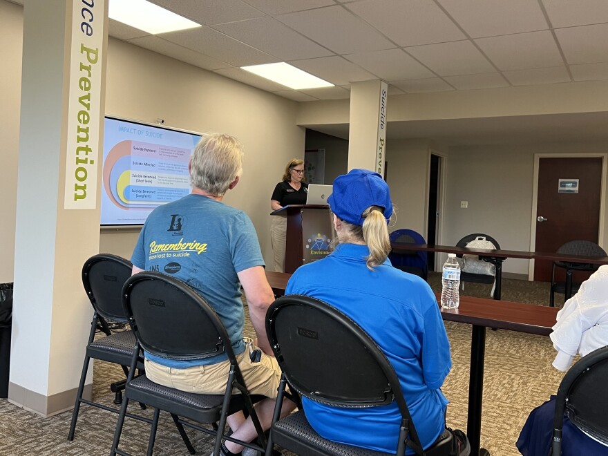 Jennifer MacLean gives a presentation on a suicide and drug overdose prevention program to interested volunteers.
