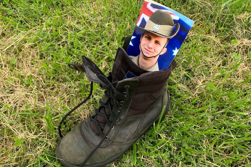 Boot with photograph of army soldier.