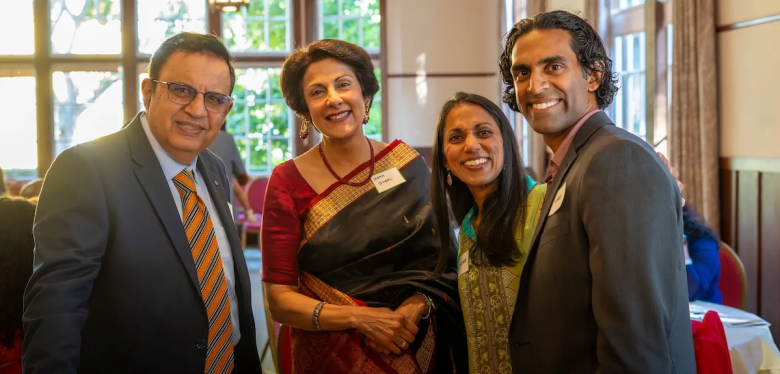 A group of people at the Rcoz gala smile at the camera