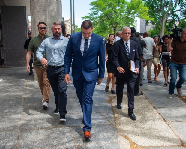 Former Hartford police officer Joseph Magnano, left, leaves Hartford Superior Court with his attorney, Patrick Tomasiewicz, right, after his arraignment on Friday, June 5, 2026. Magnano is charged with first-degree manslaughter in the fatal shooting of Steven "Stevie" Jones in February 2026. (Aaron Flaum/Hartford Courant)