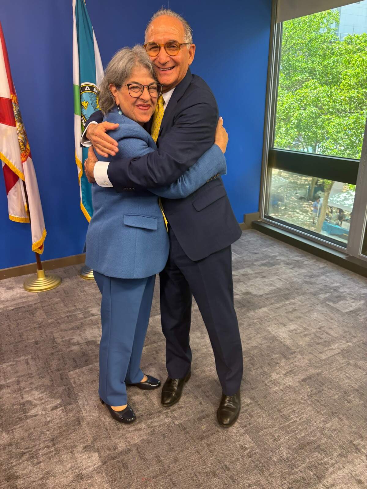 Miami-Dade Mayor Daniella Levine Cava and Steven Leifman, a retired Miami-Dade judge, share a hug on June 16, 2026, after the County Commission approved opening a mental health center Leifman has championed for decades.