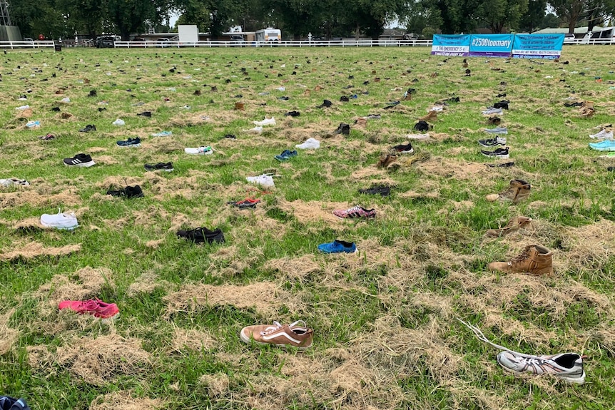 Sea of shoes spread out across oval.