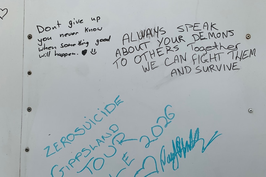 A white banner with messages of hope.