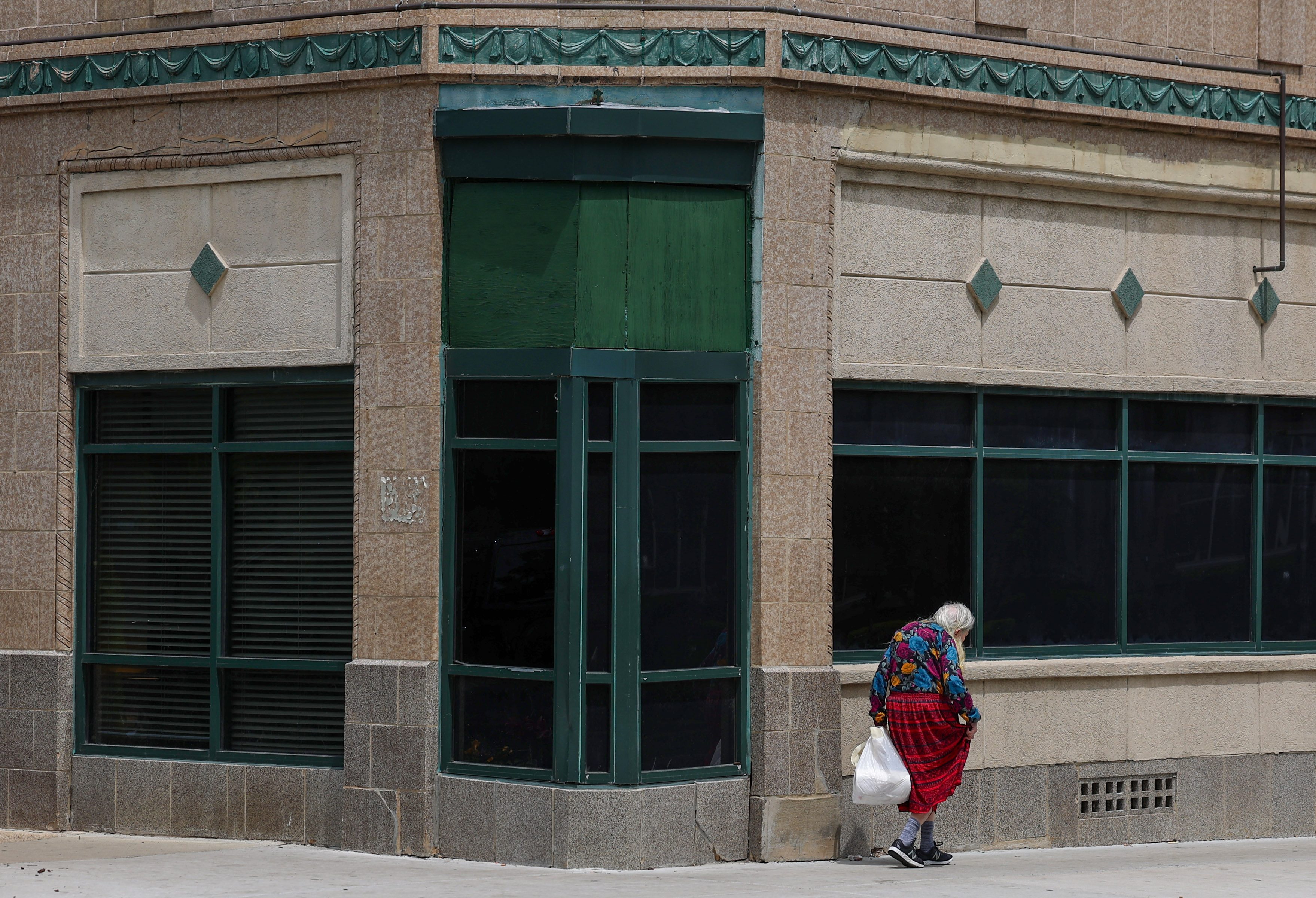 A person walks past Albany Care along the 900 block...