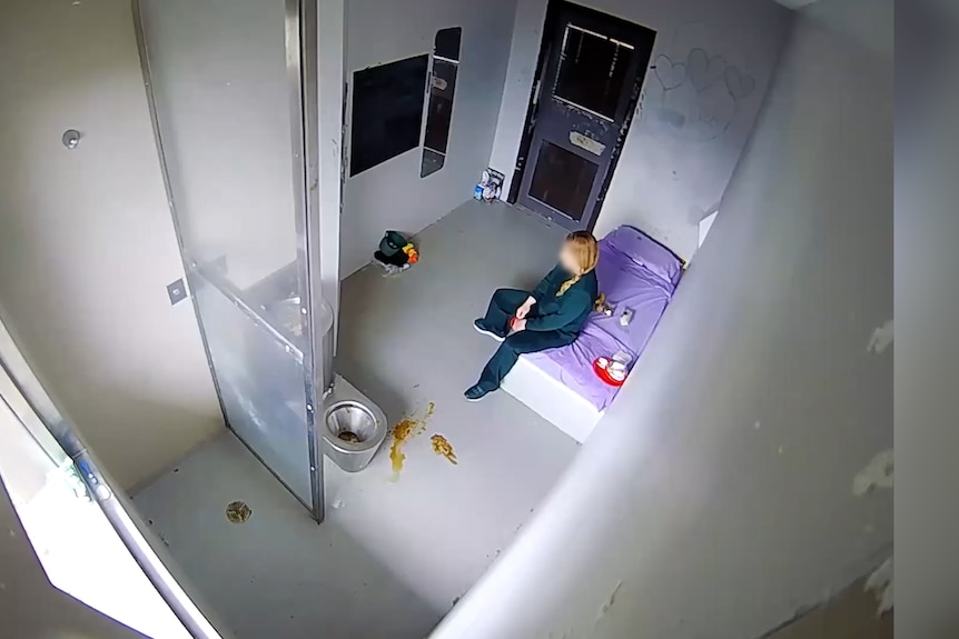 Tammy Shipley sits on the corner of a bed in a jail cell.