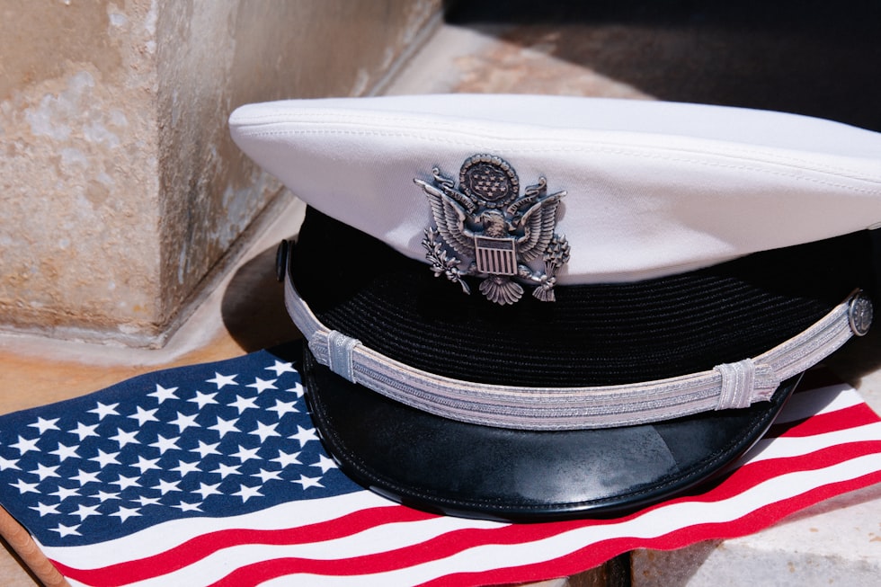 a hat sitting on top of an american flag