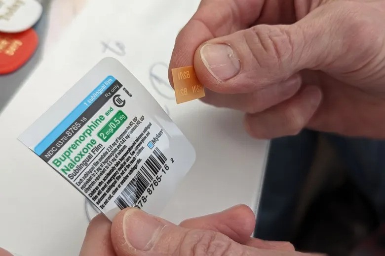 A closeup of someone handling a drug overdose reversal drug